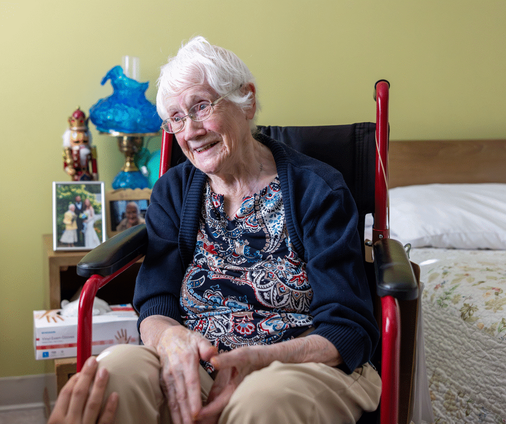 Smiling elderly woman in wheelchair
