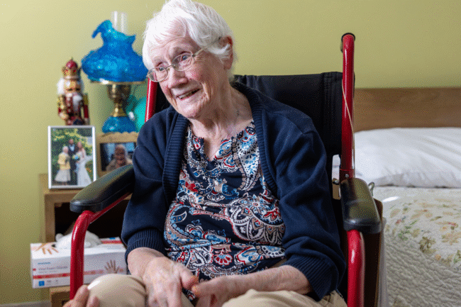 Smiling elderly woman in wheelchair
