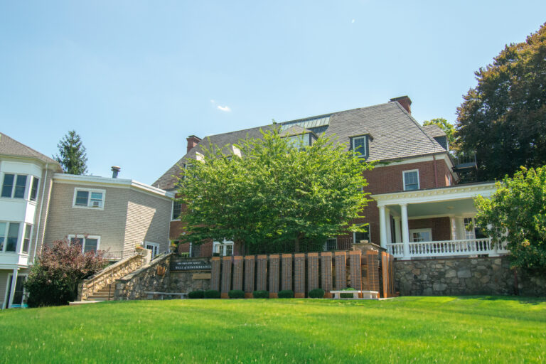 Back meadow of hospice home with Wall of Remembrance