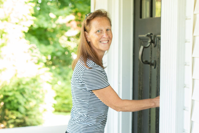 Volunteer knocking on door